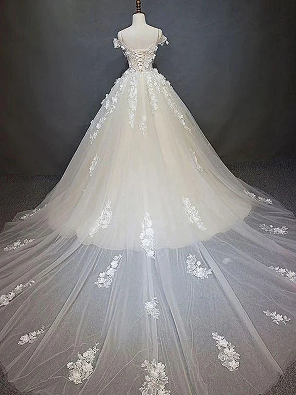 Back view of a sophisticated off-shoulder lace wedding gown.