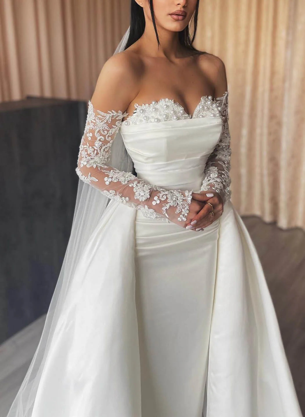 Back view of the floor-length lace bridal gown with a subtle train.