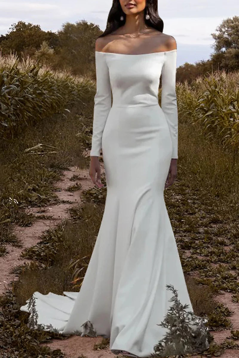 Elegant off-shoulder long bridal gown with a flowing skirt.