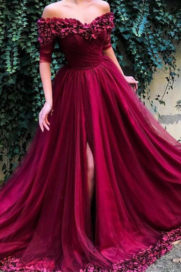 Elegant off-shoulder long prom dress on a model, front view.