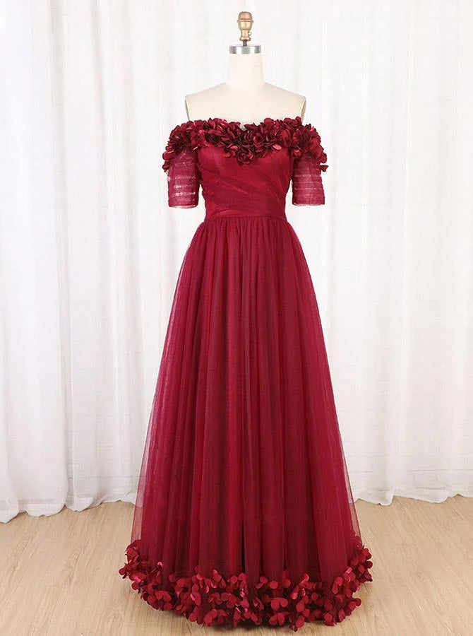 Back view of the off-shoulder long prom dress worn by a model.