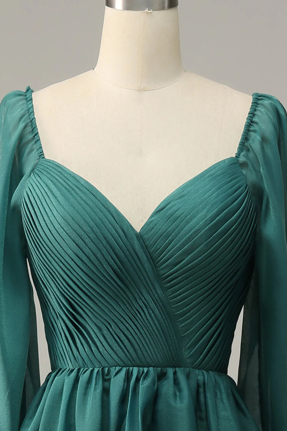 Back view of the dark green long sleeve off-shoulder prom dress.