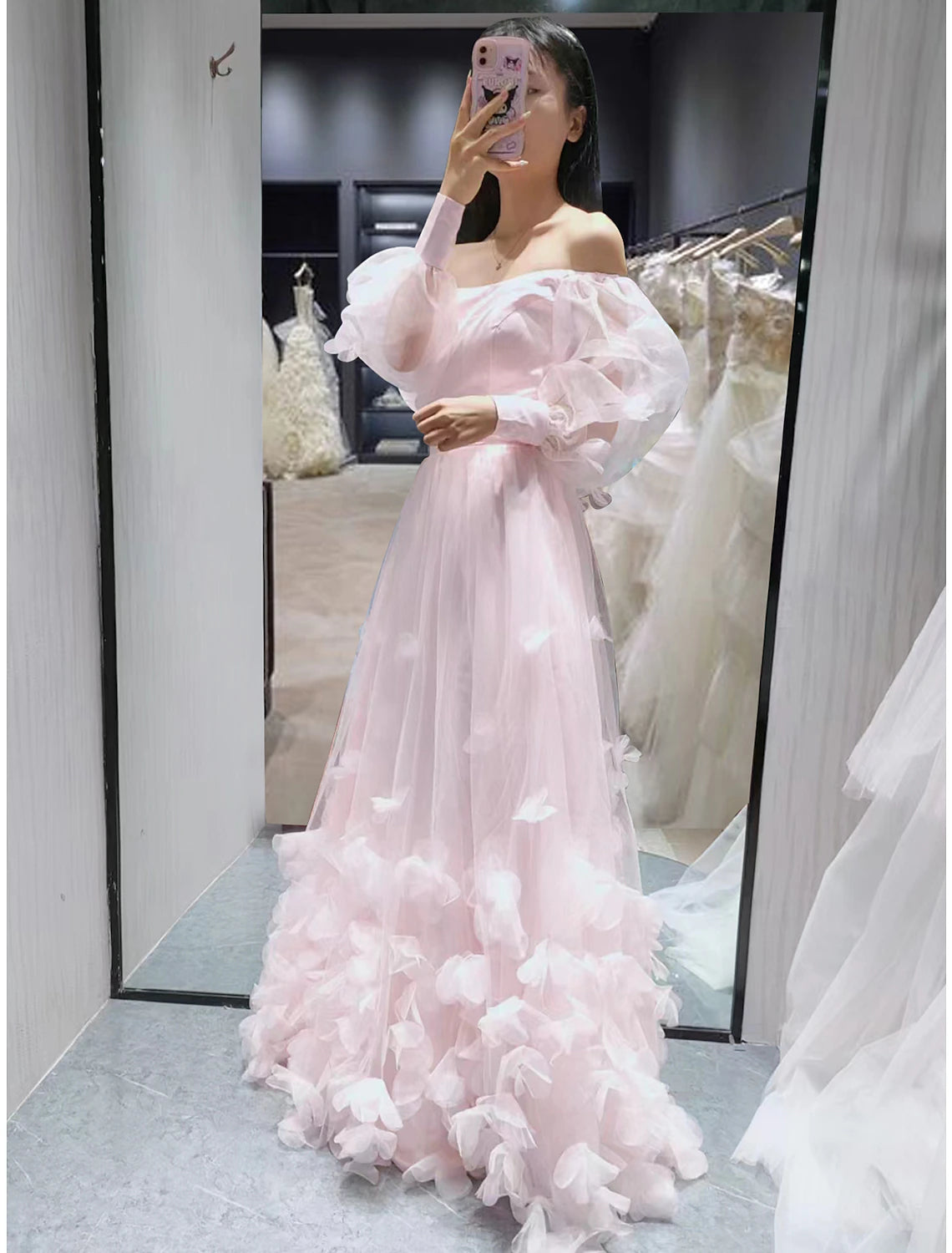 Elegant off-shoulder long sleeve A-line ball gown with floral appliques.