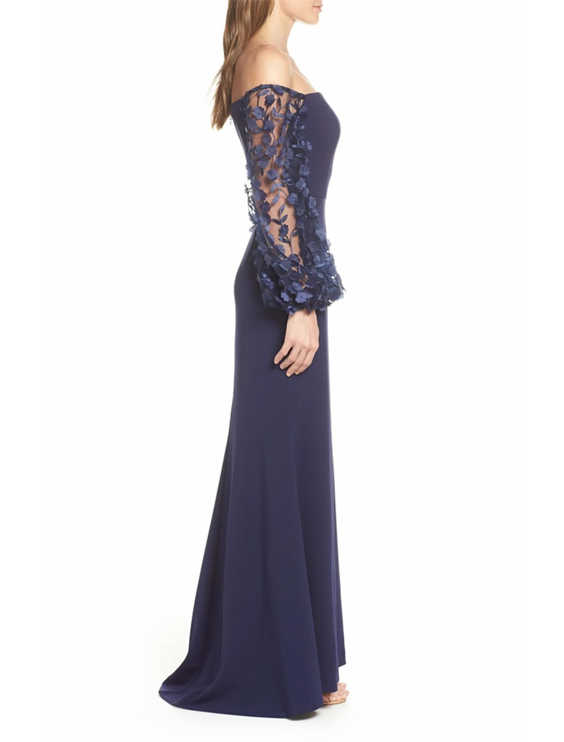 Close-up of applique details on the stretch fabric of the gown.