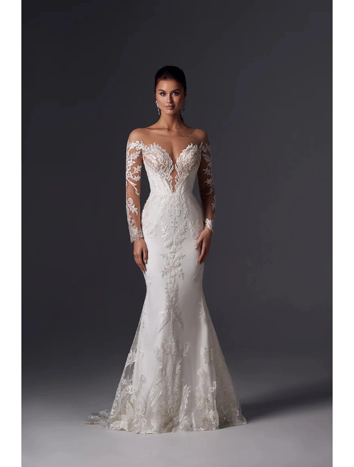 Elegant off-shoulder long sleeve mermaid wedding dress with appliques and court train.