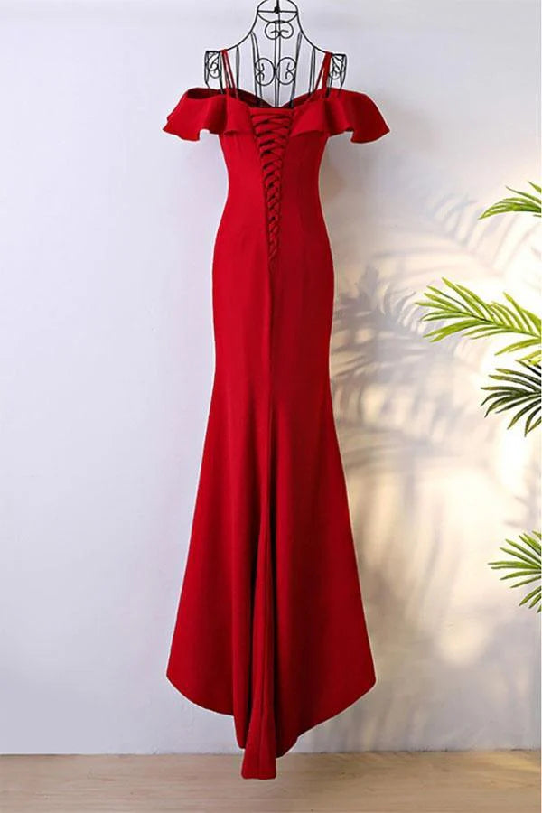 Back view of the off-shoulder mermaid prom gown, showcasing the train and spaghetti straps.