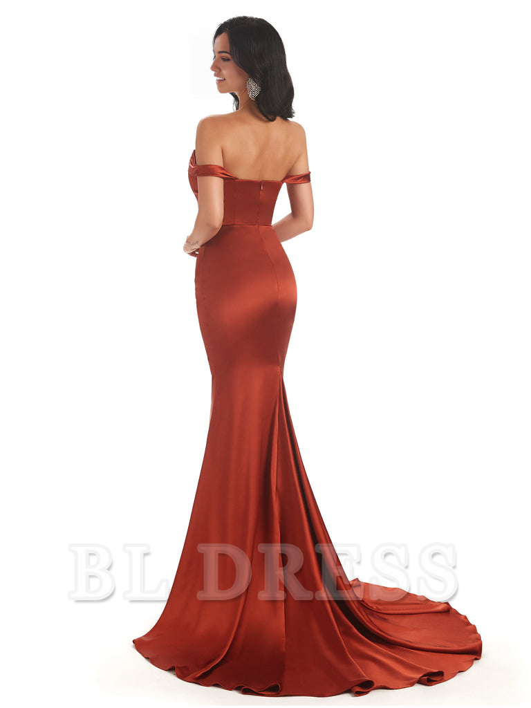 Back view of a woman wearing an off-shoulder mermaid satin gown.