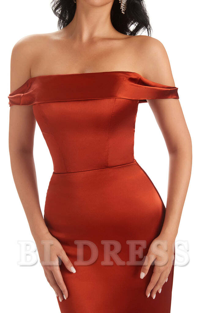 Close-up of the satin fabric and off-shoulder detail of the dress.