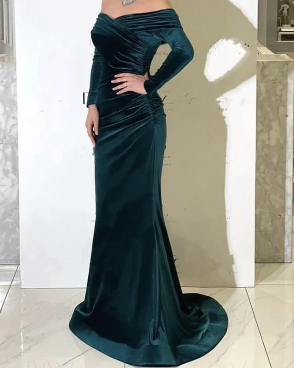 Back view of hunter green velvet off-shoulder mermaid evening dress.