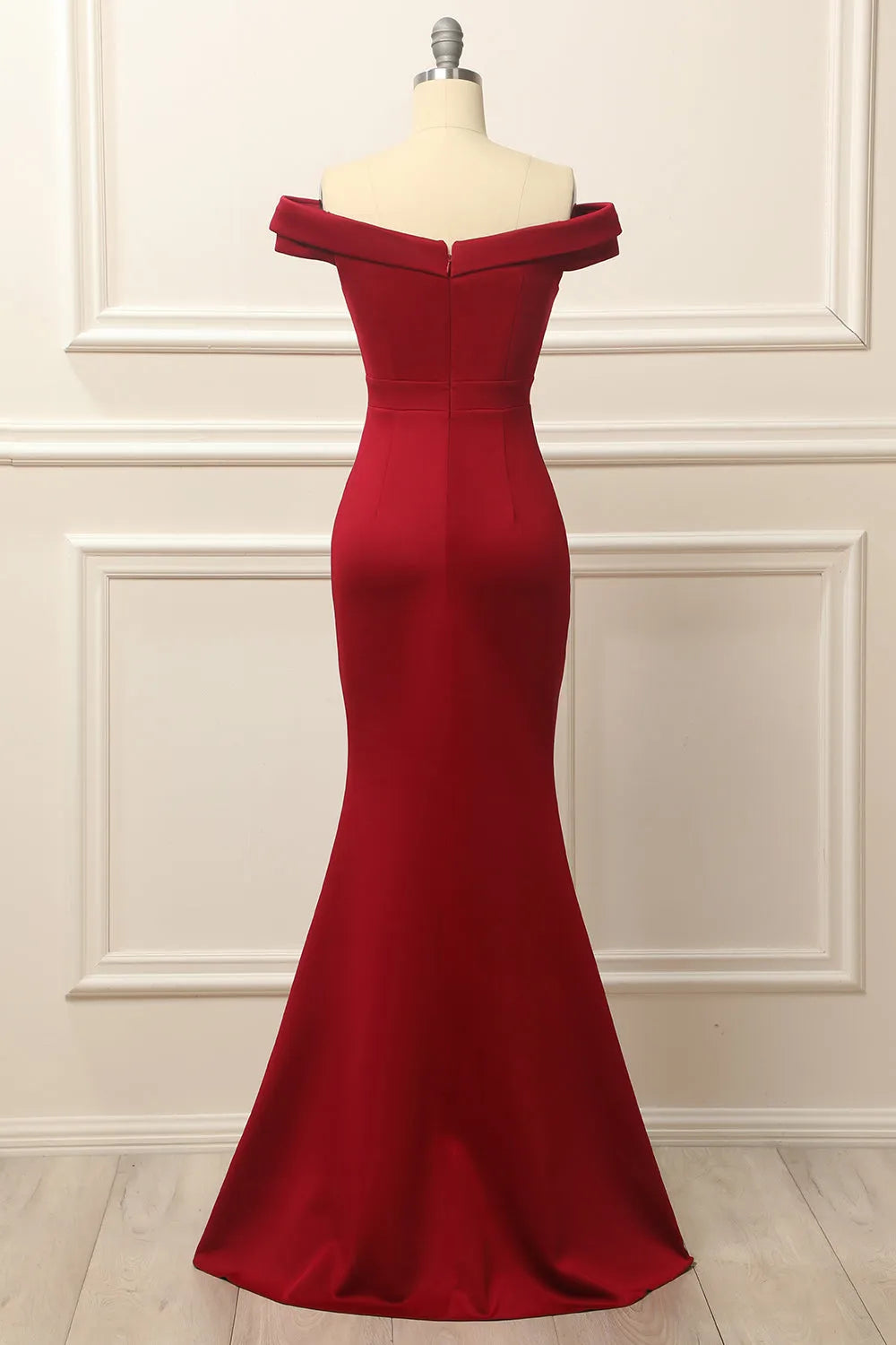Mermaid wedding dress with a flowing train, side view.