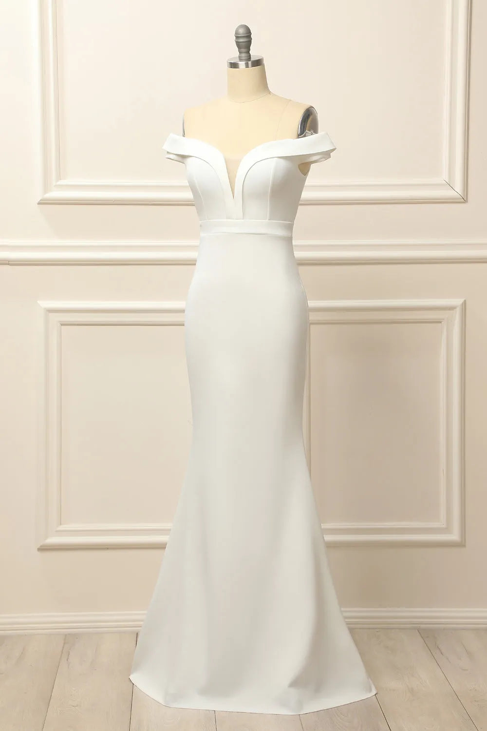 Close-up of the off-shoulder neckline and bodice of the wedding dress.