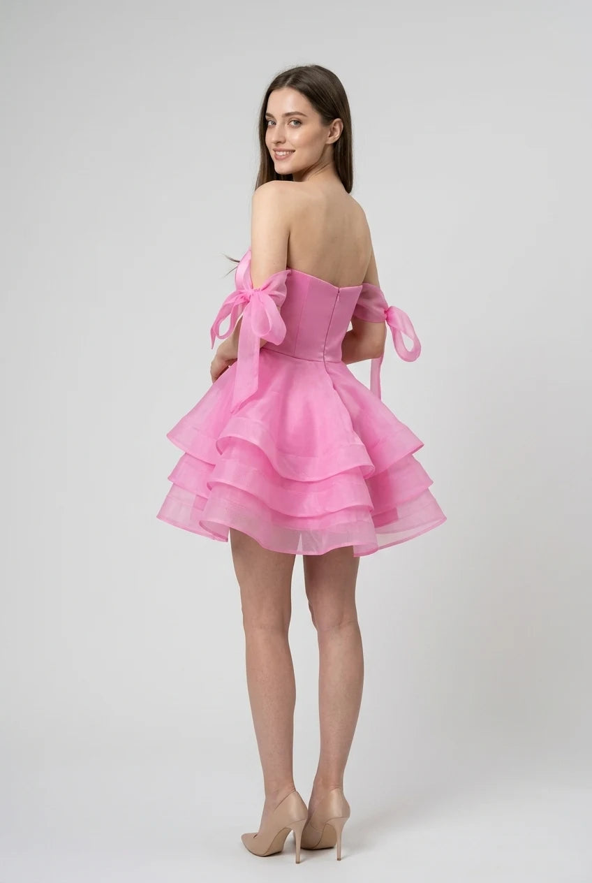 Pink chiffon off-shoulder mini ball gown with flowing skirt.