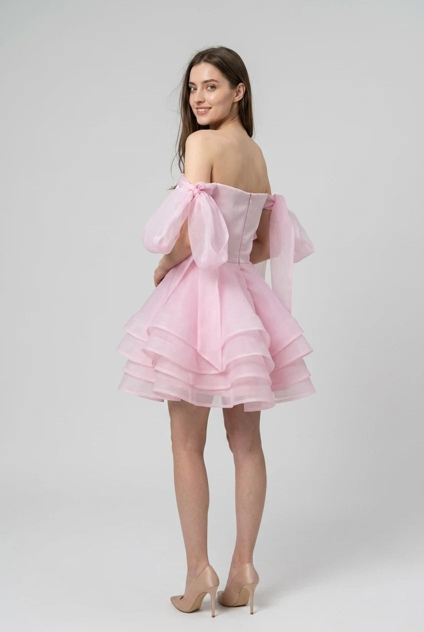 Pink chiffon off-shoulder mini ball gown, front view.