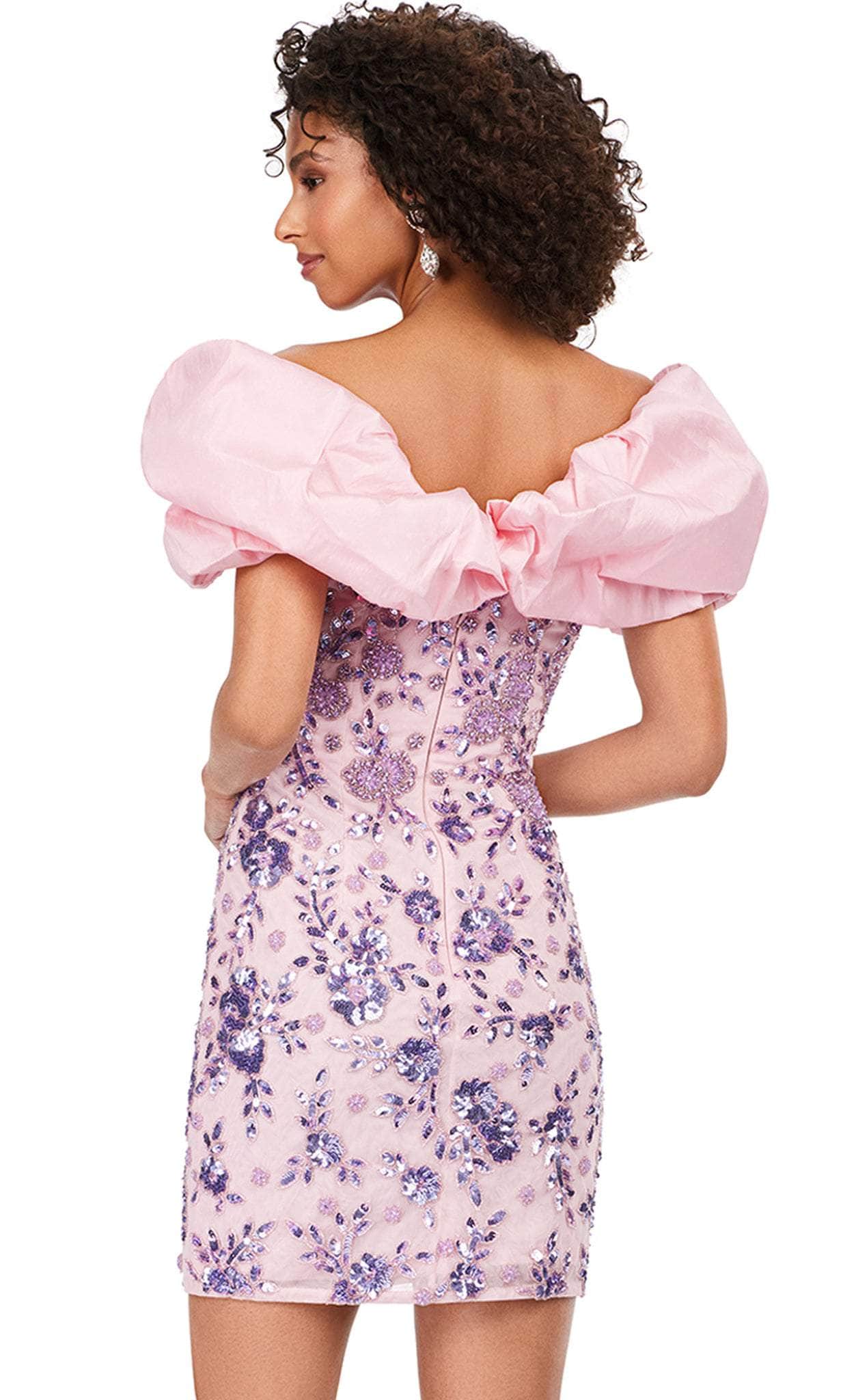 Close-up of floral embroidery on pink off-shoulder mini dress.