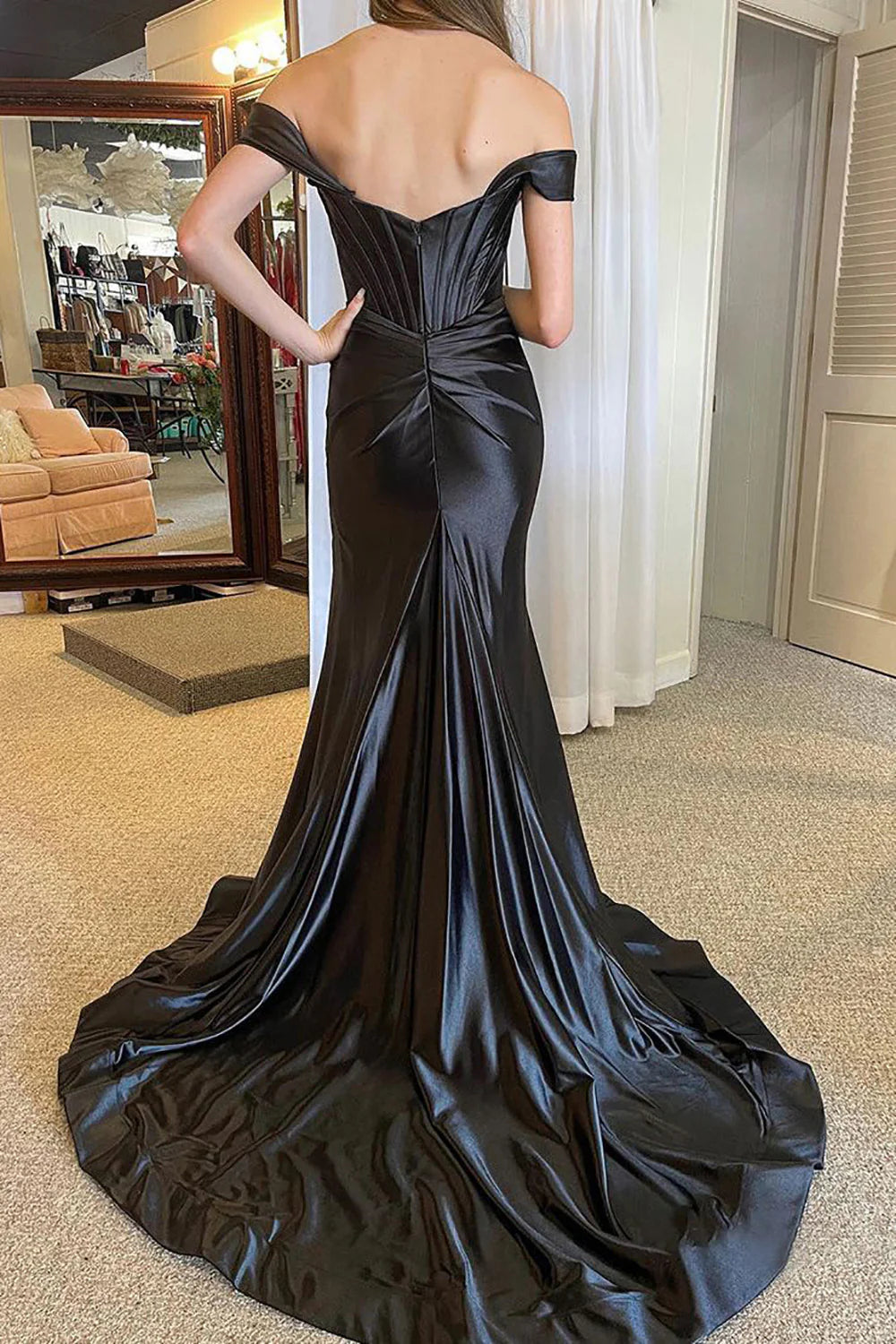 Back view of the off-shoulder satin mermaid prom dress, showcasing the corset detailing.