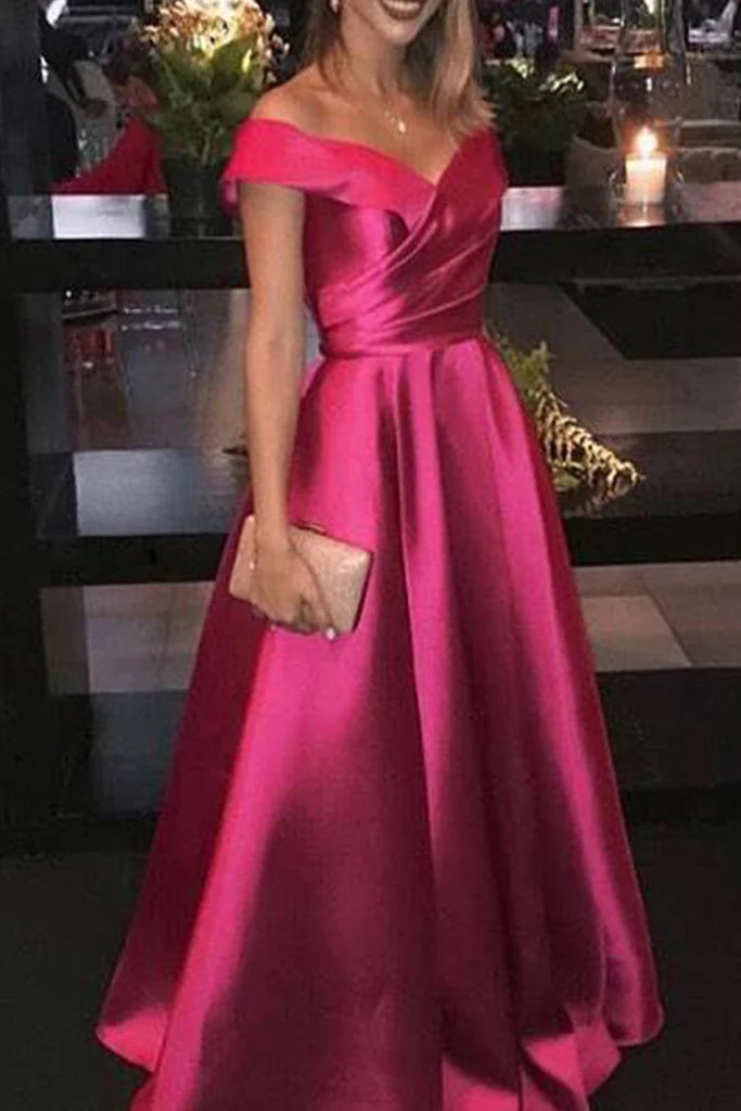 Woman wearing an elegant off-shoulder satin long prom gown.