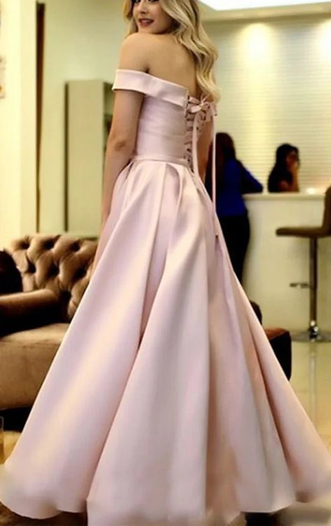 Full view of a dark off-shoulder satin formal gown.