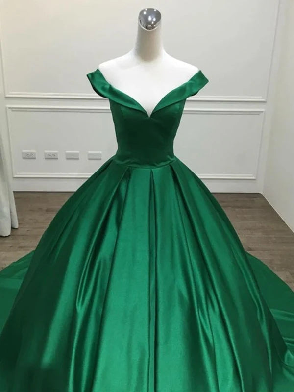Back view of elegant off-shoulder dress with dramatic train.