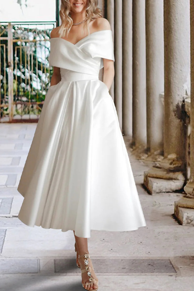 Model wearing an elegant off-shoulder satin tea length wedding dress, front view.