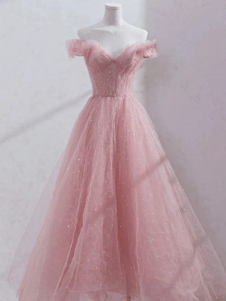 Model wearing an elegant off-shoulder sequin and tulle A-line long prom dress.