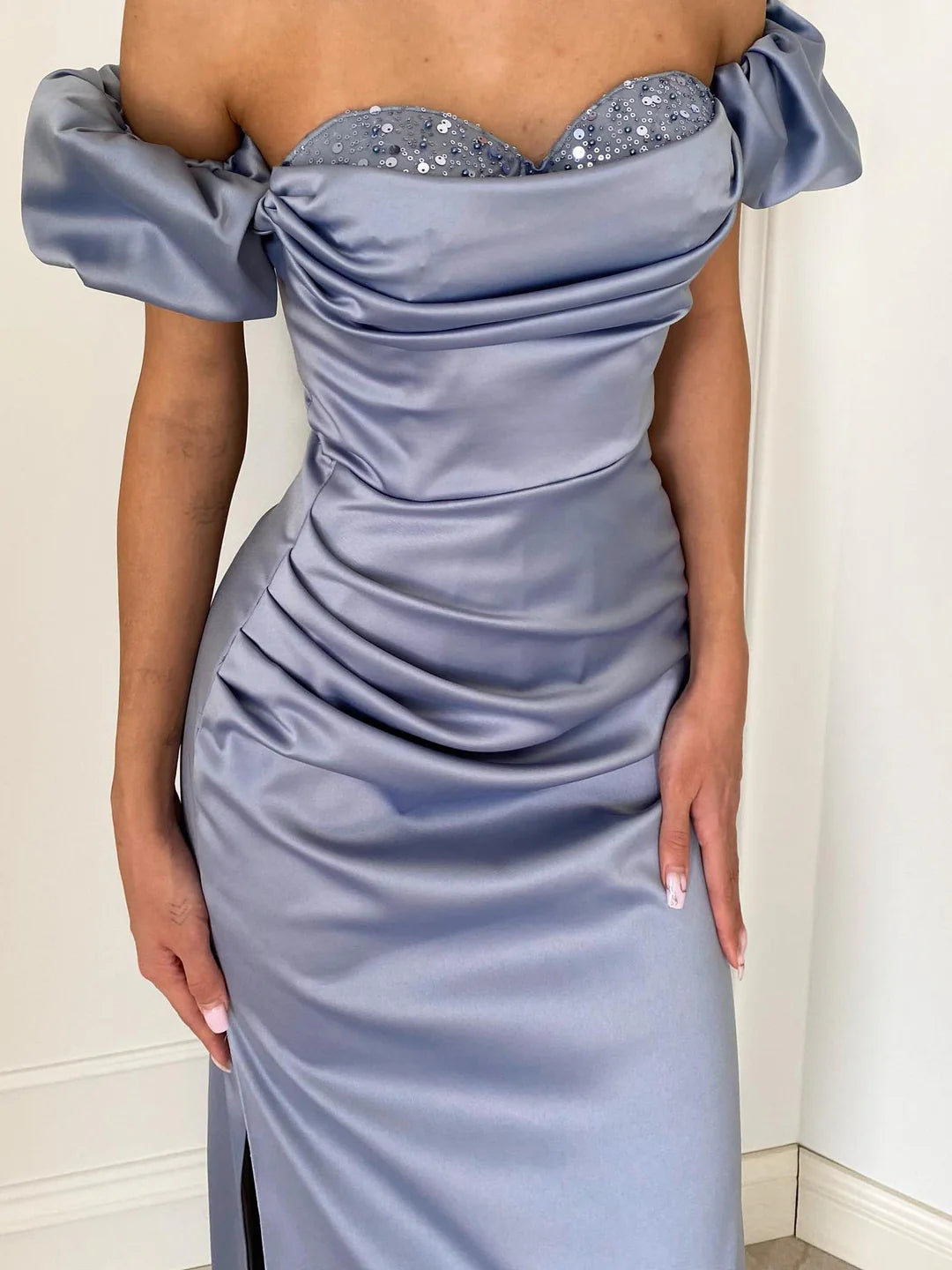 Elegant off-shoulder sheath floor-length gown for formal events.