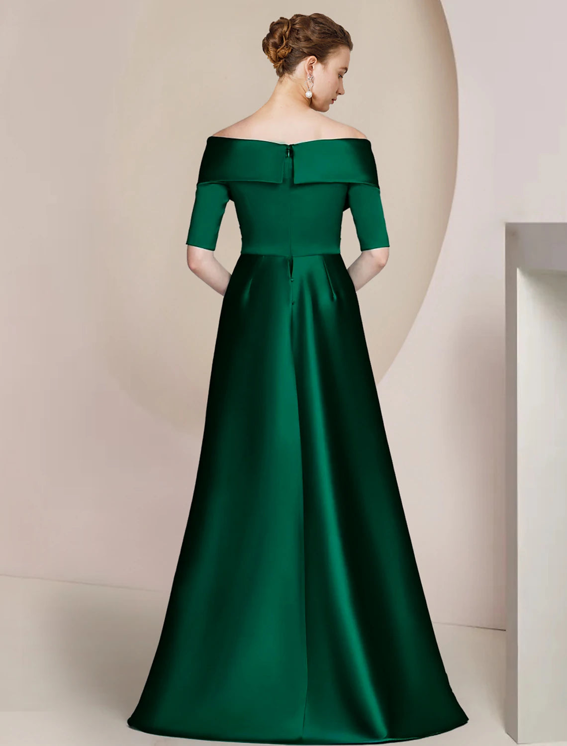 Side view of navy blue satin sheath dress, highlighting ruching detail.