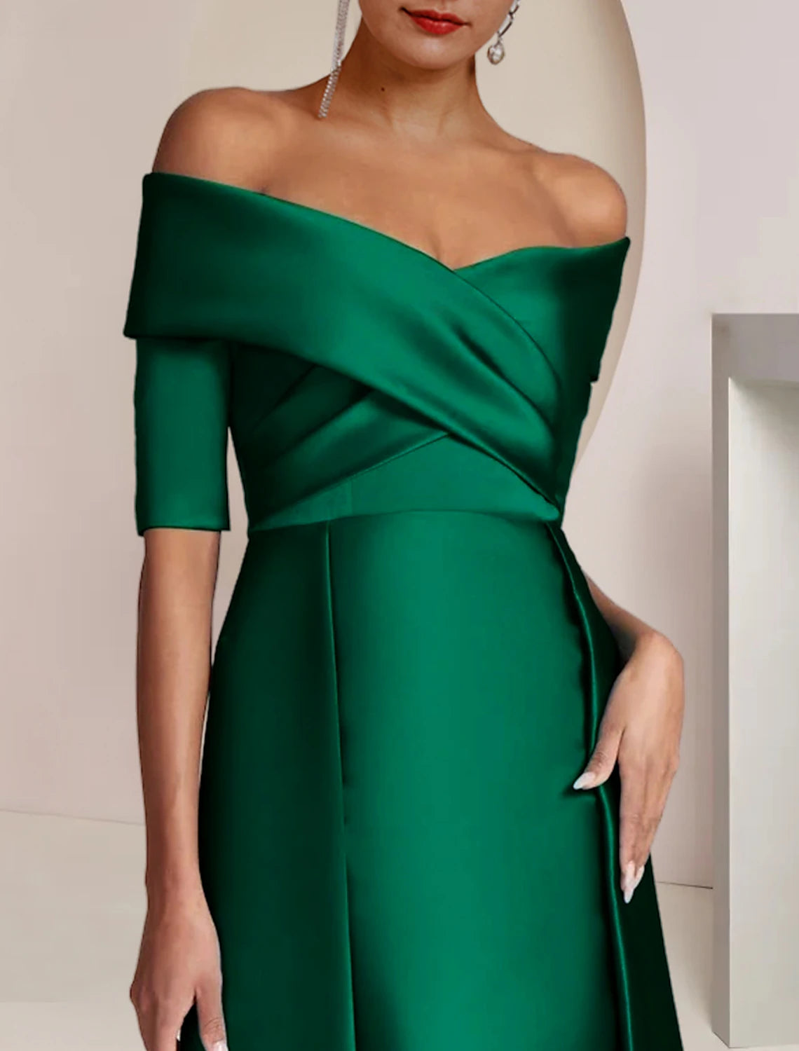 Back view of a floor-length navy blue formal gown.