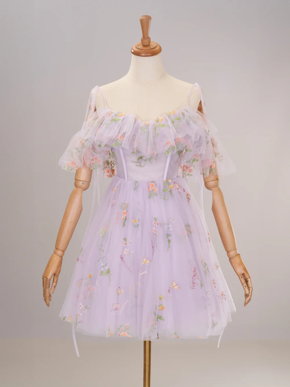 Elegant periwinkle off-shoulder corset homecoming dress with ruffled skirt.
