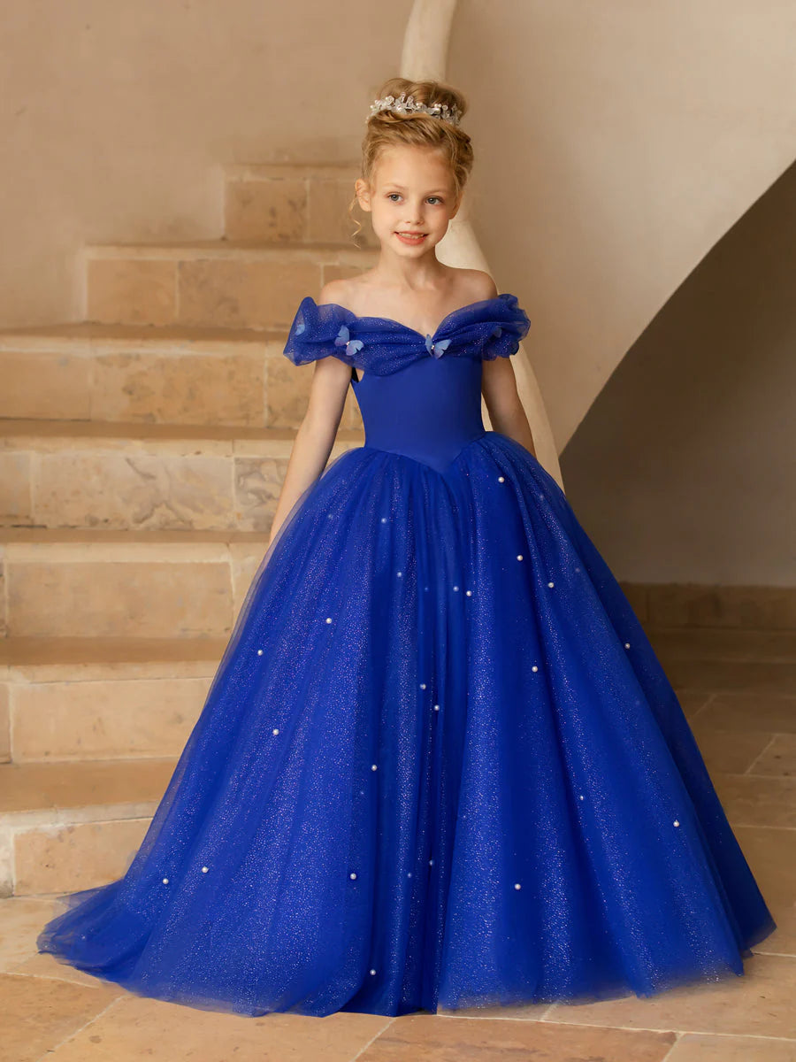 Flower girl dress with off-the-shoulder neckline, tulle skirt, and pearl embellishments.