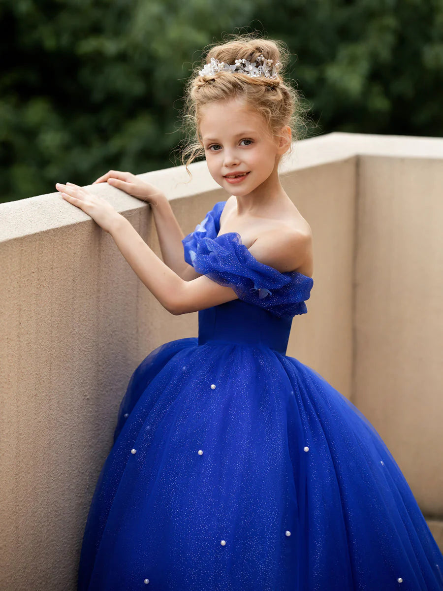 Back view of an elegant flower girl dress featuring a full tulle skirt.