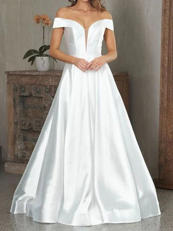 Woman wearing an elegant off-shoulder V-neck satin long prom dress.