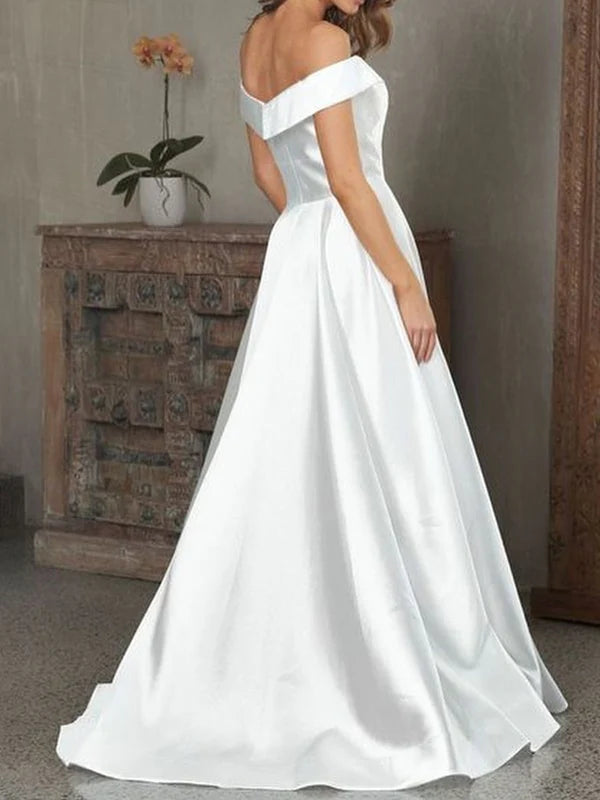 Model showcasing the long satin formal gown with V-neck and off-shoulder design.