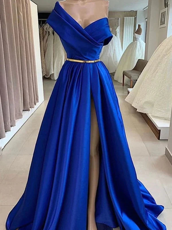 Woman wearing an elegant one shoulder A-line long formal prom dress.