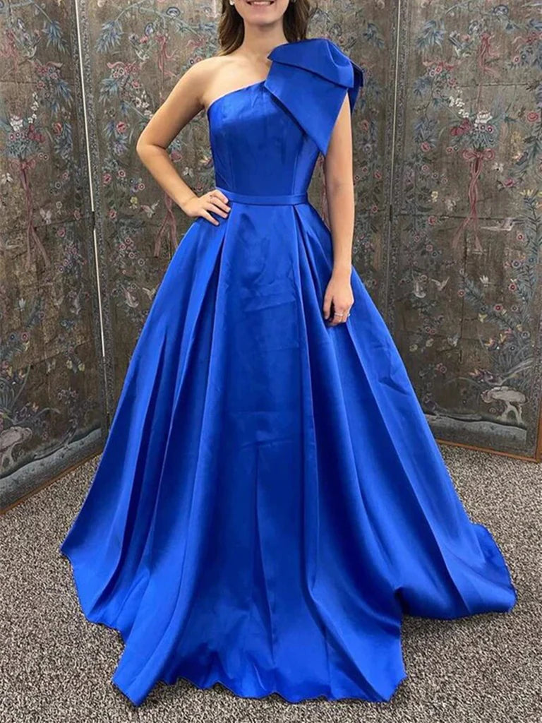 Woman in an elegant navy blue one-shoulder A-line long prom dress.