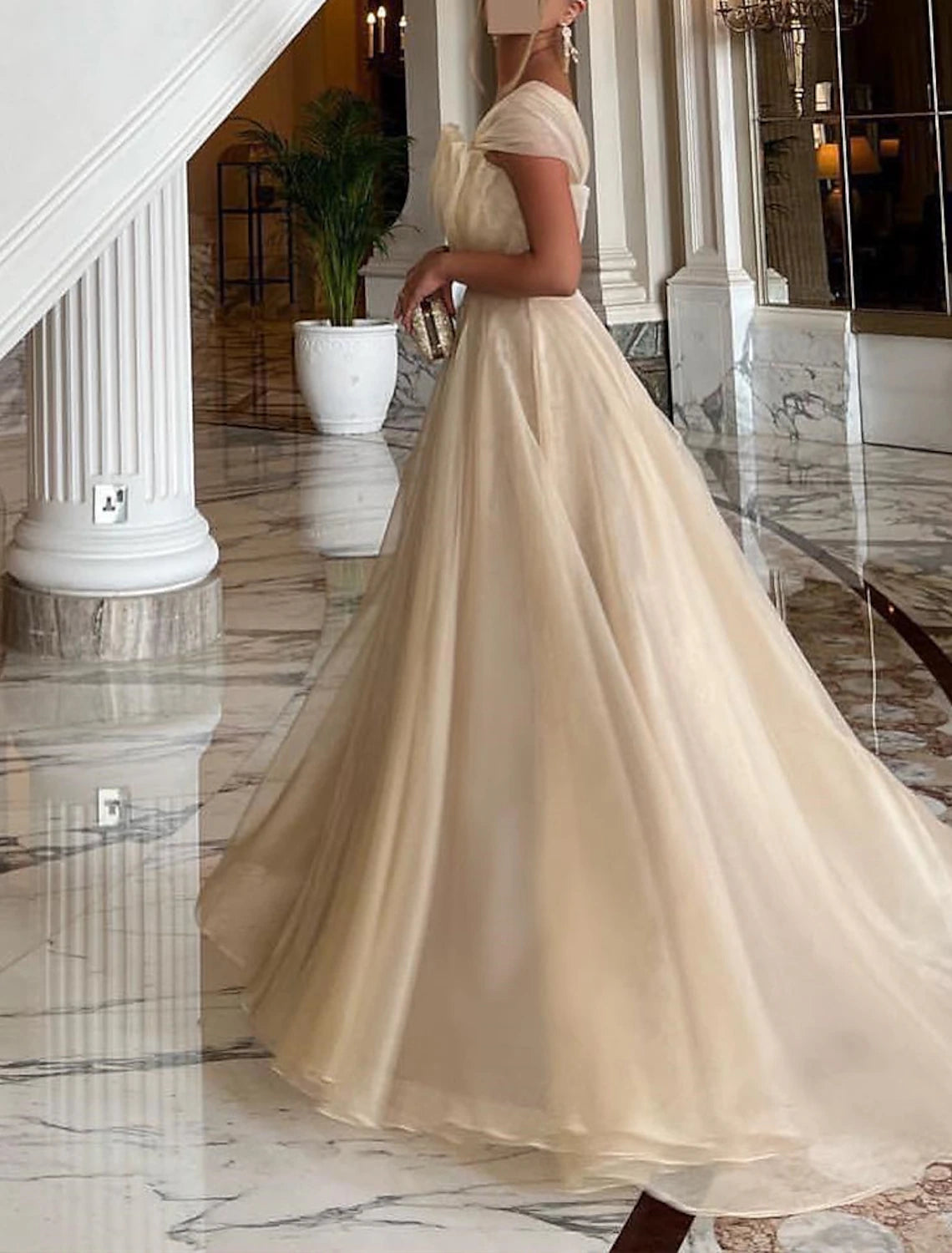 Side view of the sophisticated organza one-shoulder ball gown.