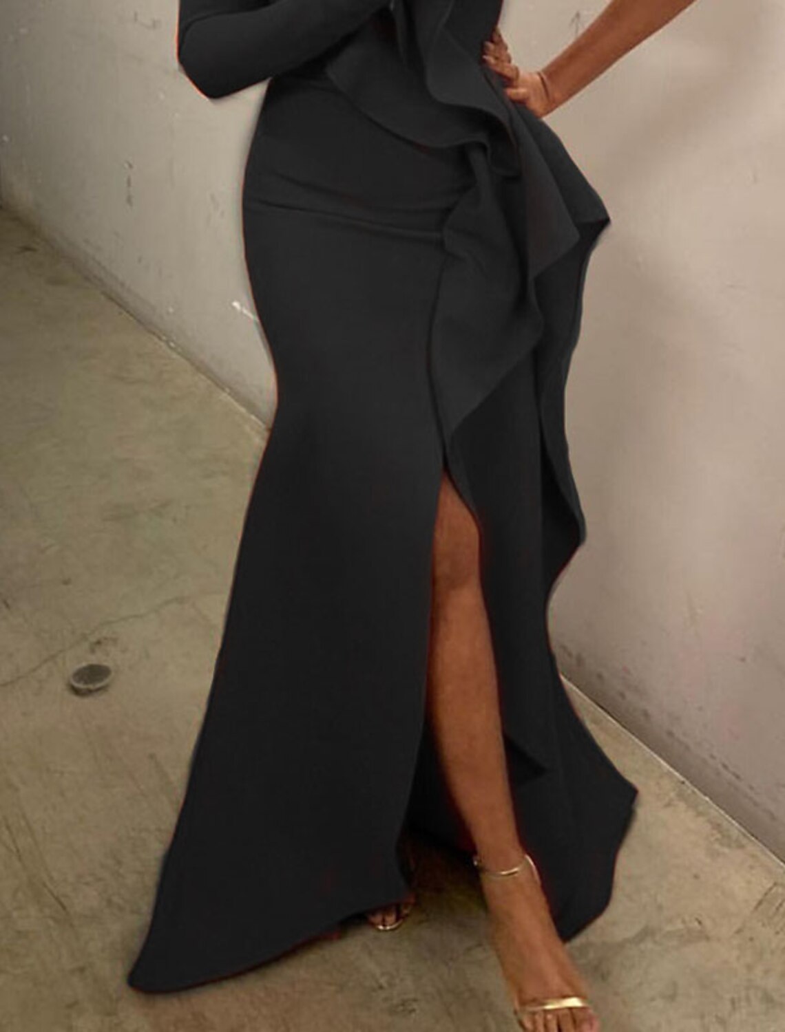 Close-up of the stretch fabric and one-shoulder detail on the evening dress.