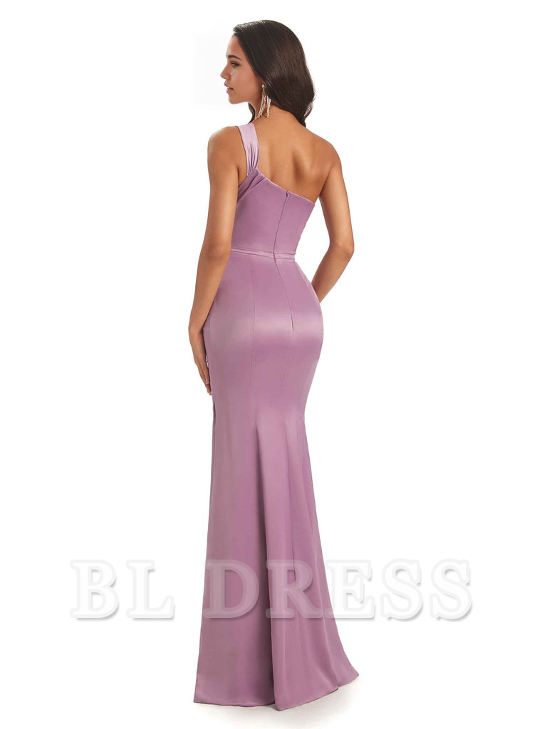 Back view of a woman in a teal one-shoulder mermaid satin evening gown.