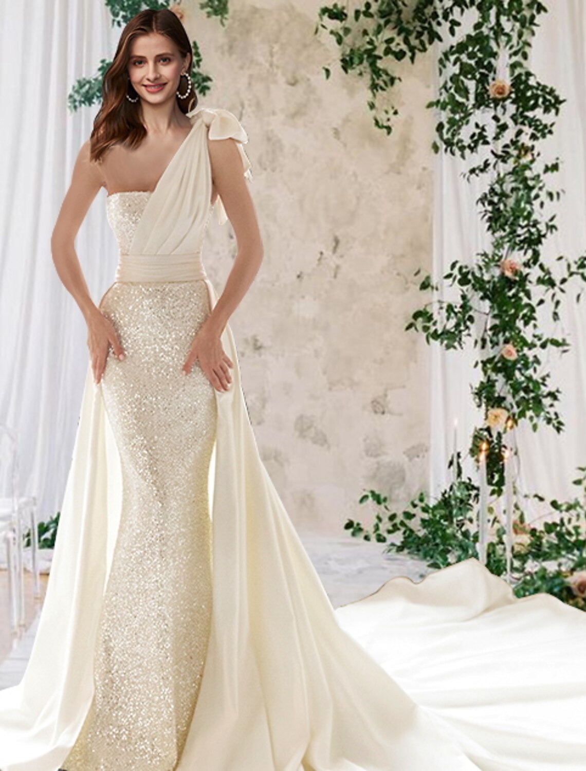 Elegant one-shoulder mermaid wedding dress with sequin details and a court train.