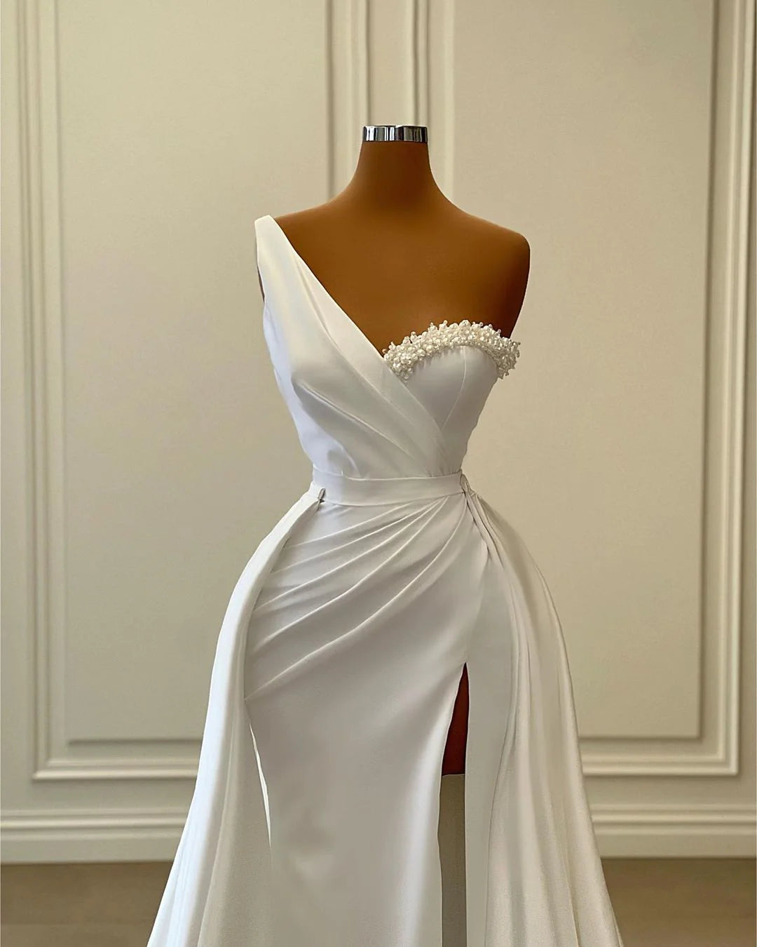 Glamorous one-shoulder formal dress with a long train.