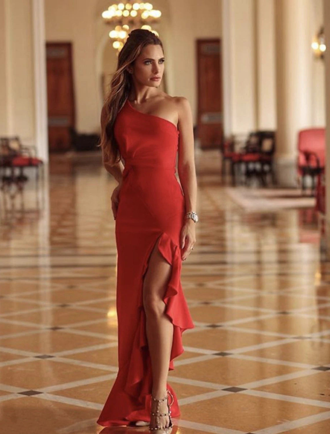 Close-up of the asymmetrical lace and pleats on the formal evening gown.