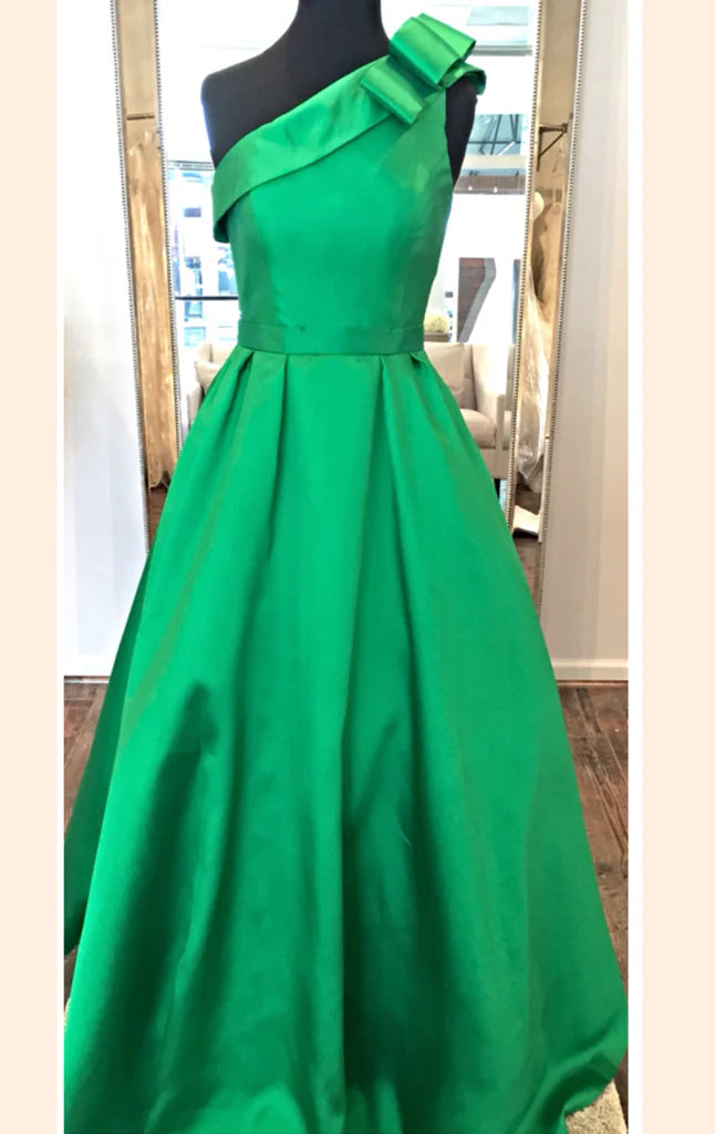 Side view of the one-shoulder satin prom dress.