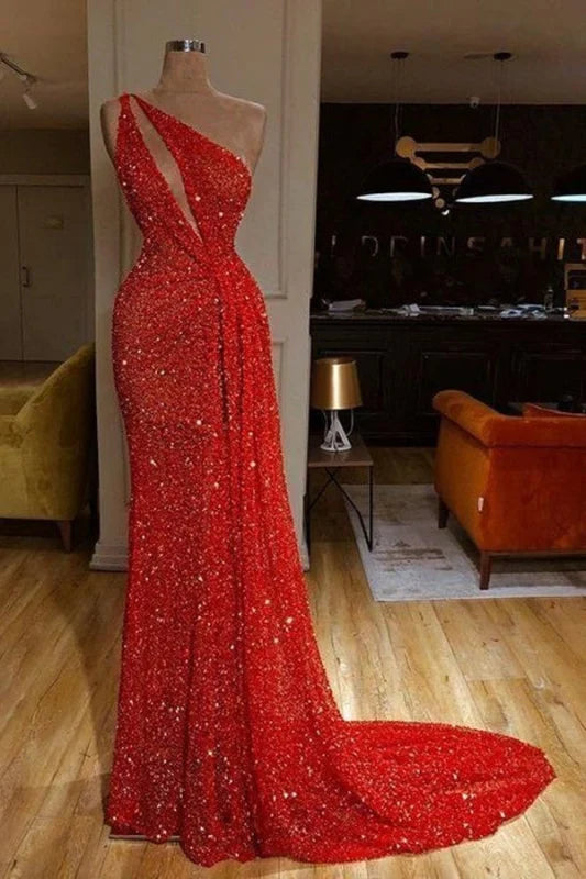 Woman wearing a sparkling one-shoulder sequin long prom dress.