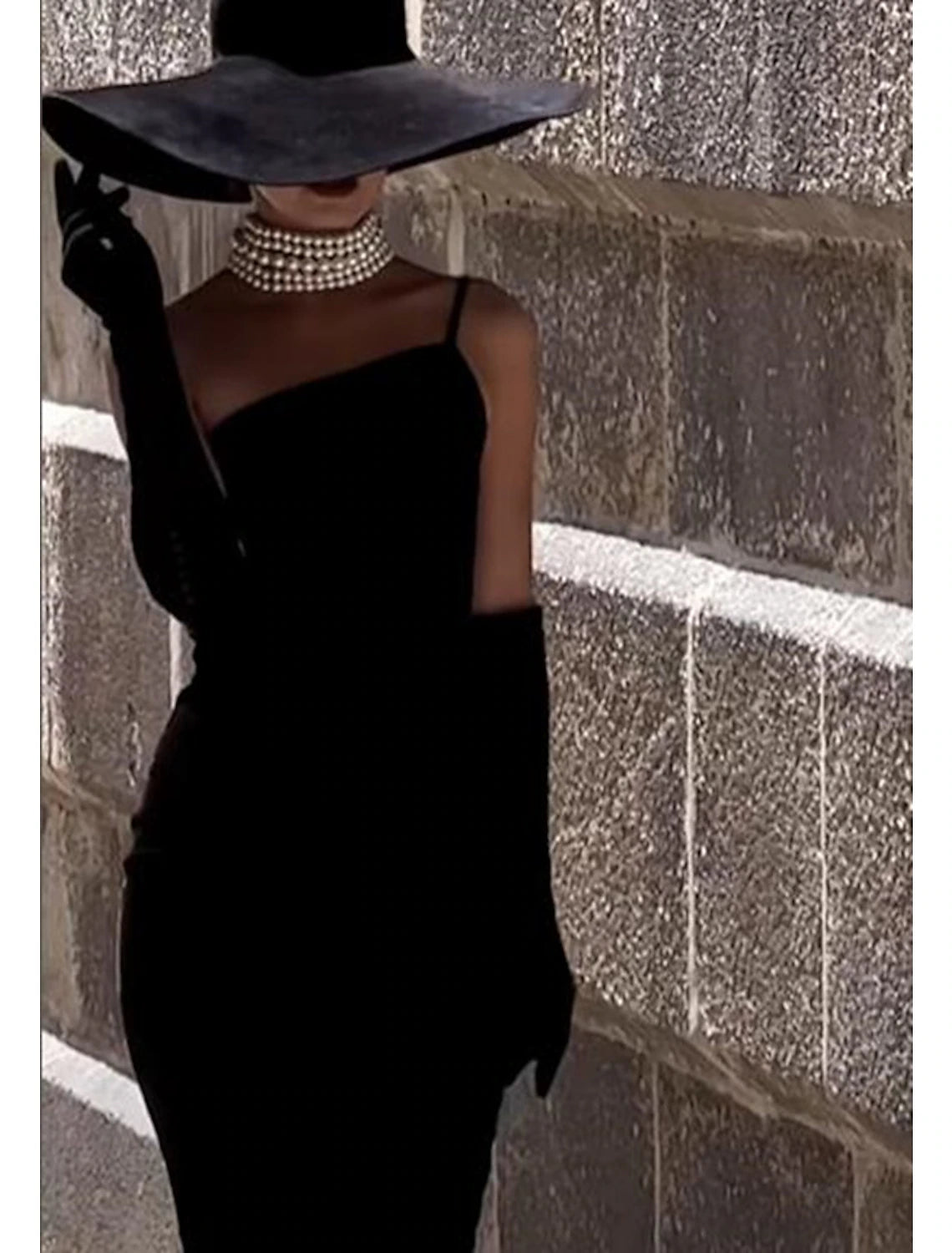 Back view of the one-shoulder tea-length sheath cocktail dress.
