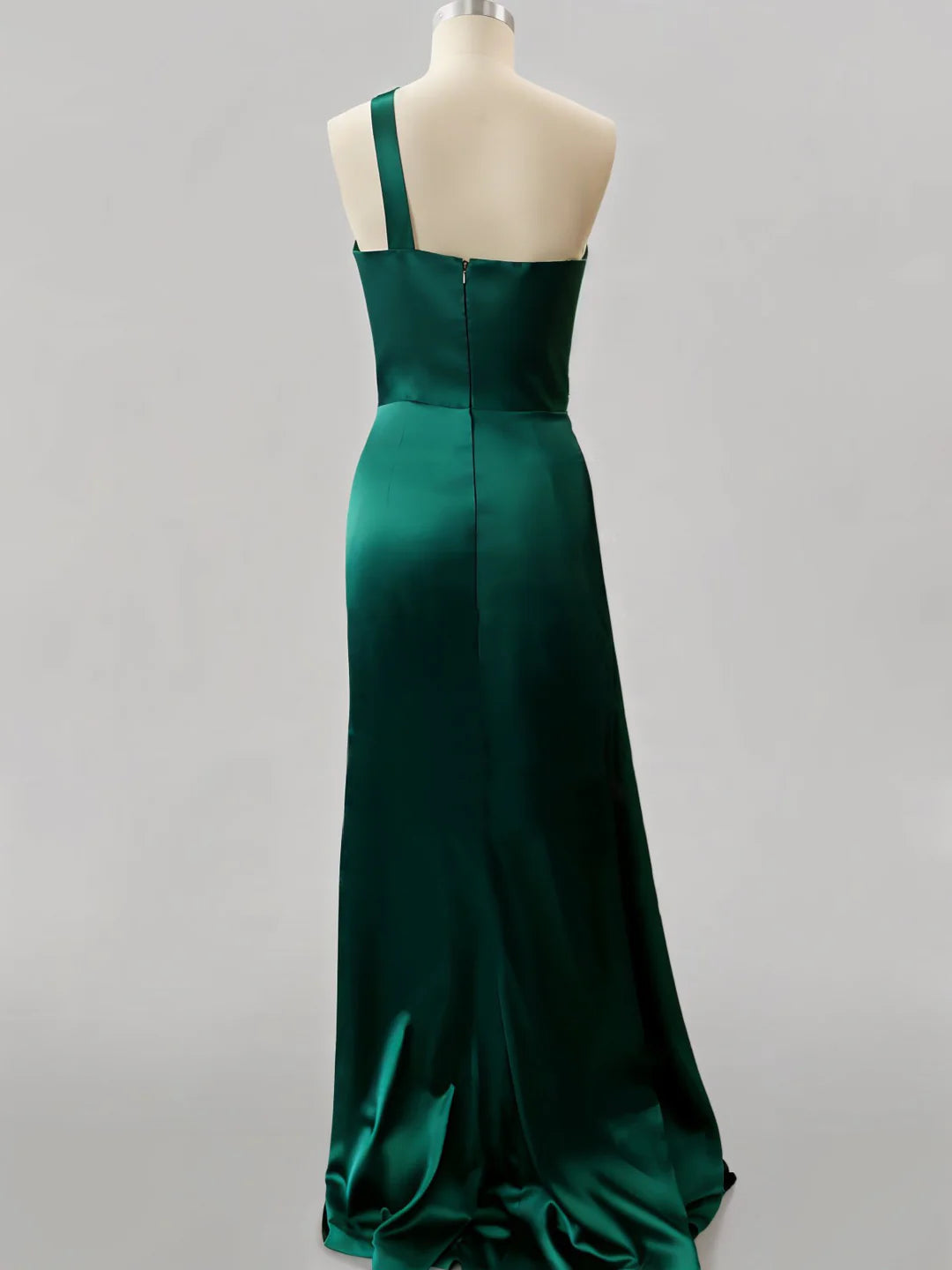 Full view of a woman in a one-shoulder formal evening dress.