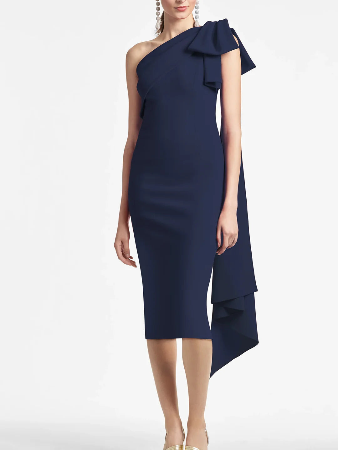 Woman wearing an elegant one-shoulder knee-length sheath dress, perfect for a formal event.