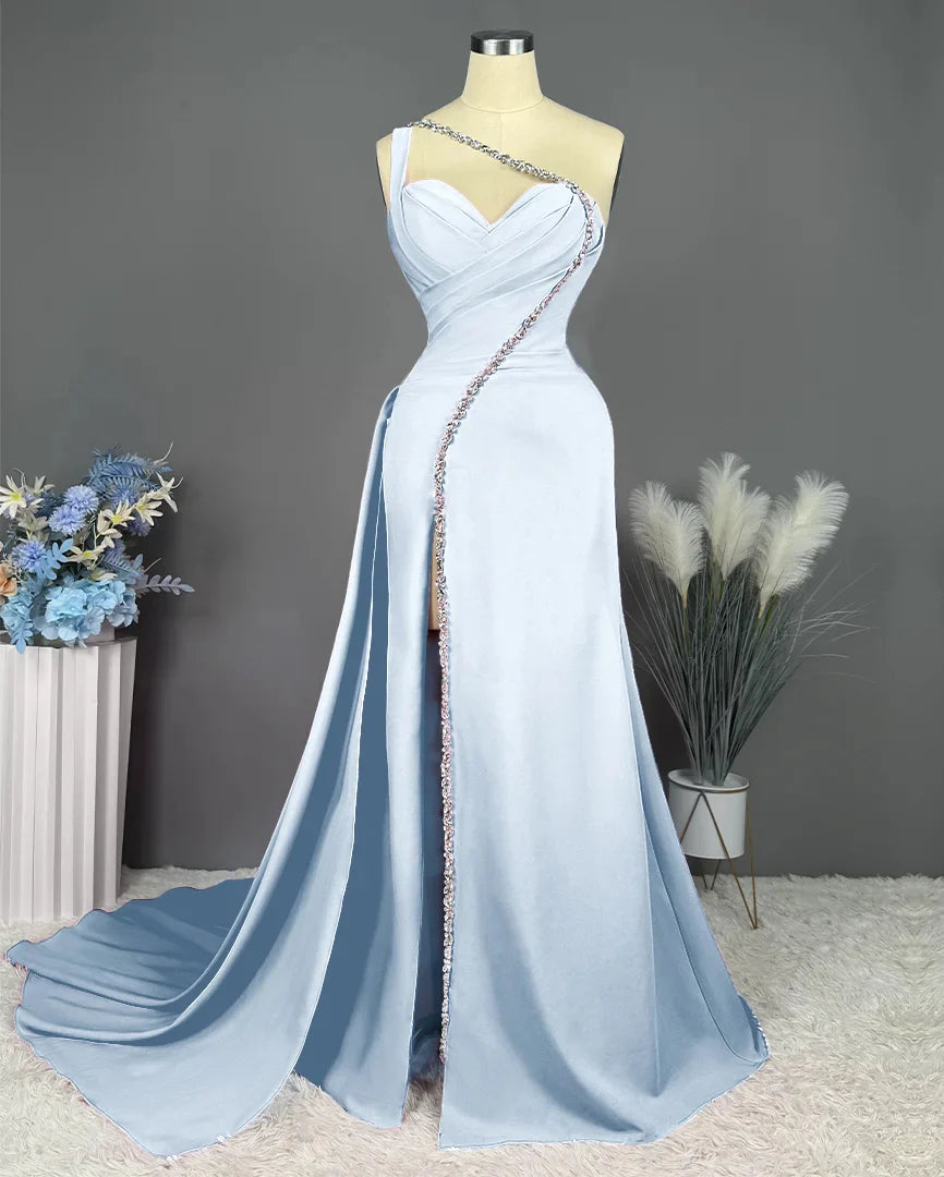 Back view of a one-shoulder sheath formal gown.