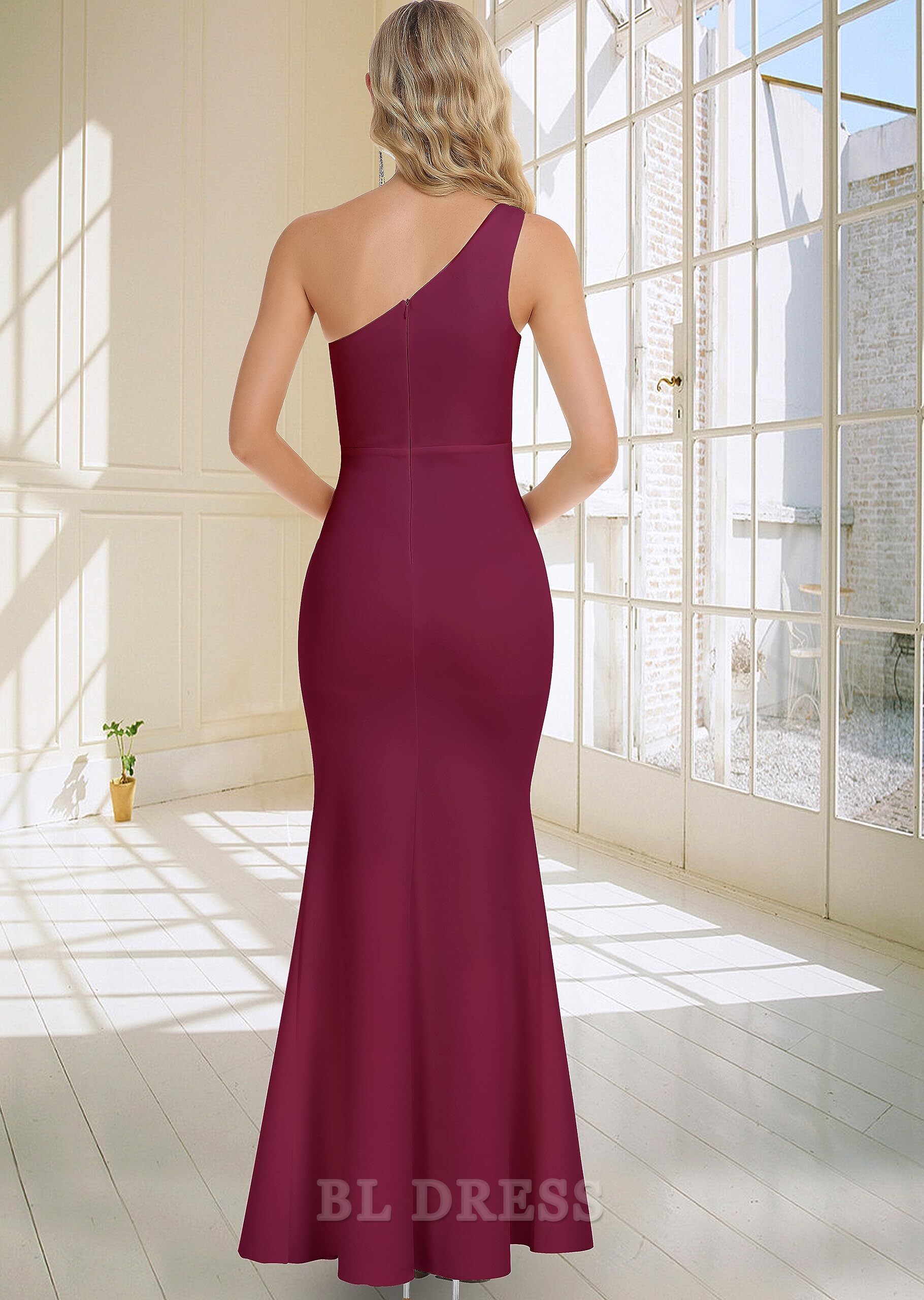 Back view of the one-shoulder ruched bodycon dress, showcasing its sleek silhouette.