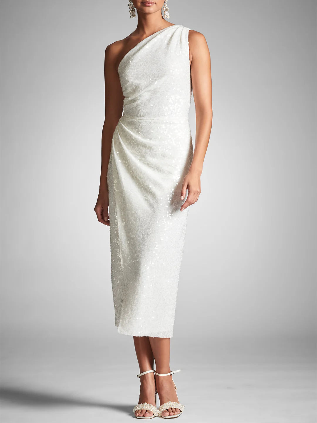 Model wearing an elegant one-shoulder sheath tea-length dress.