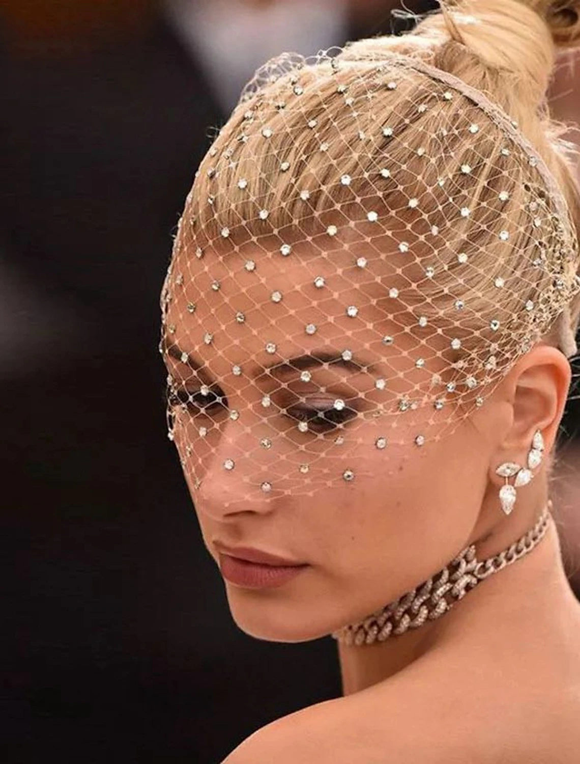 Bride wearing an elegant one-tier blusher wedding veil with sparkling crystals.