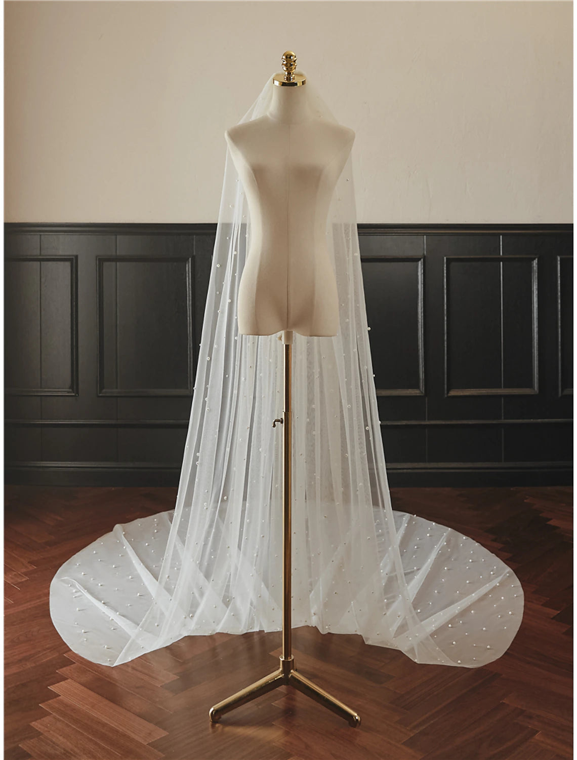 Back view of a bride wearing the 300cm cathedral veil, showing its elegant length.